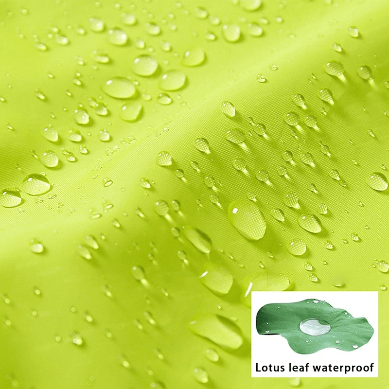 Close-up of waterproof green polyester jacket fabric with beads of water showing durable water repellent features for outdoor use.